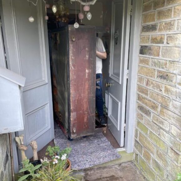 Collecting piano, moving out of doorway, out of the house. Piano Disposal.